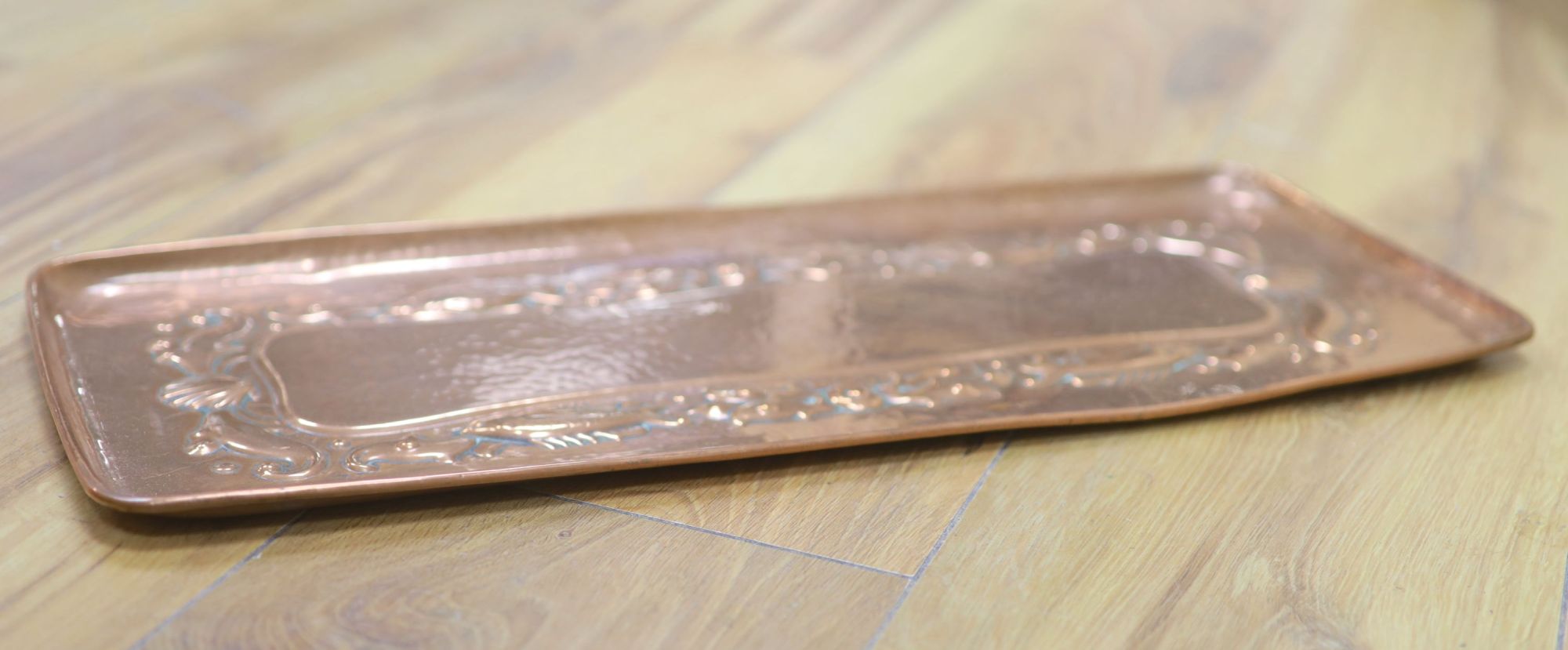 A Newlyn copper tray, stamped mark, 47 x 19.5cm